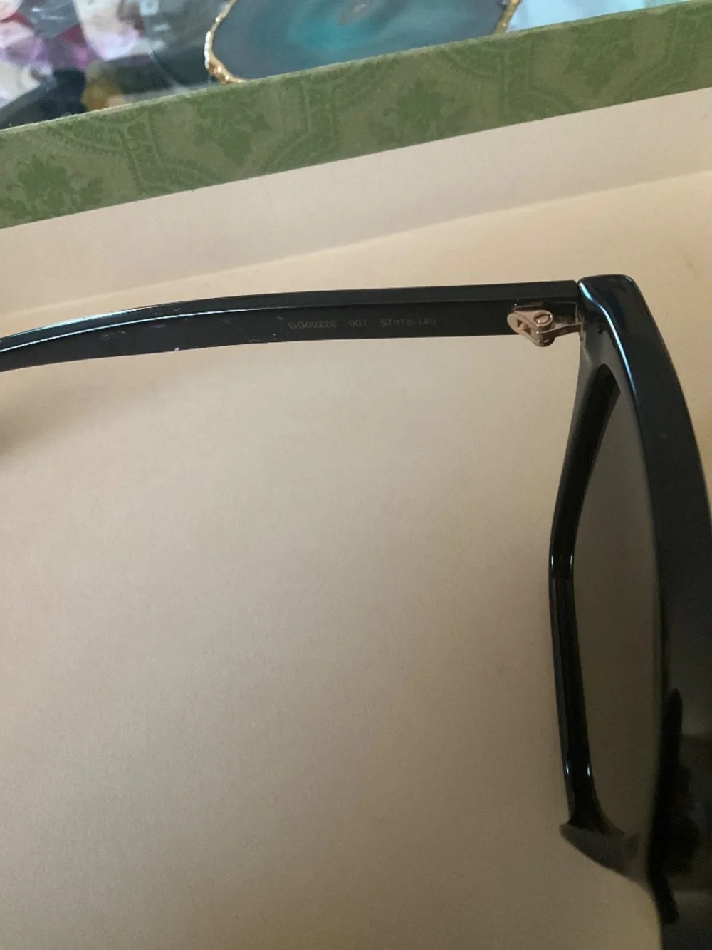 GUCCI GG0022S Women's Cateye Sunglasses Black Gold Logo/Grey Smoke Gradient 57mm